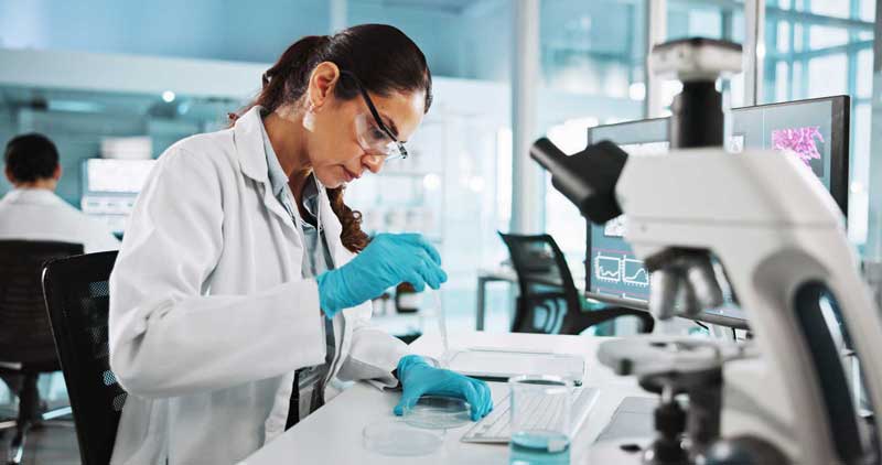 Scientist with microscope