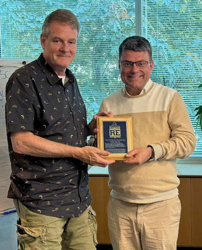 Dr. Frédéric Marsolais receiving his commendation from Jean Bérubé